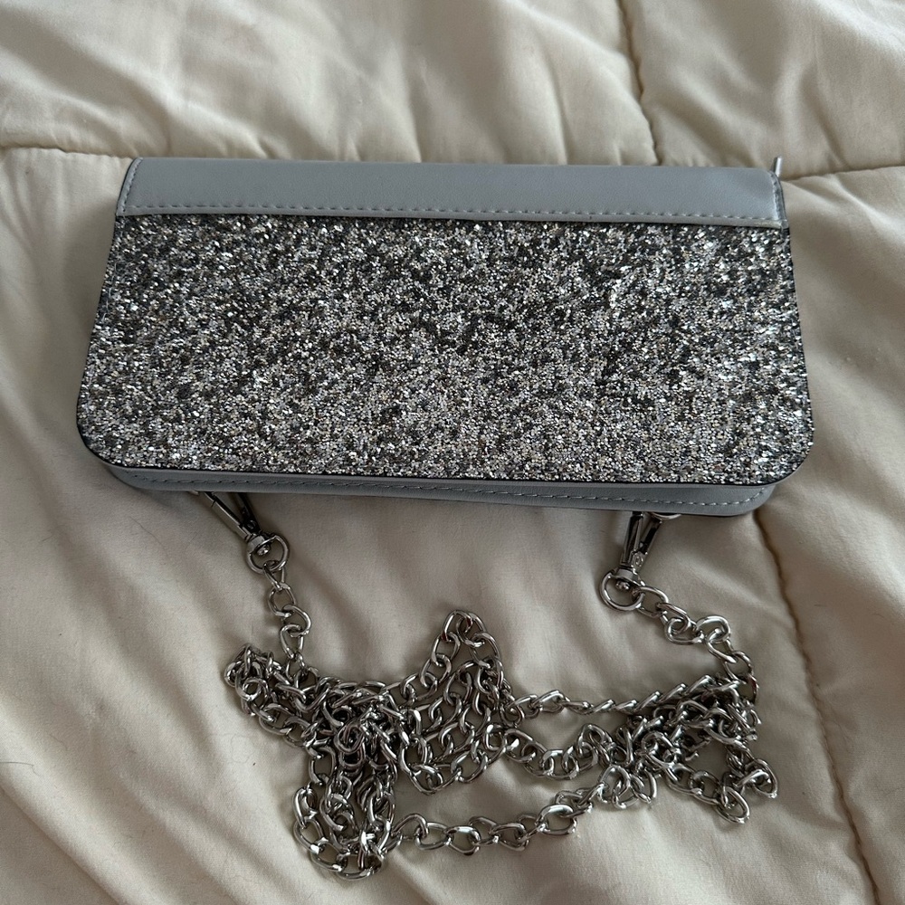Silver Maurice’s wallet with chain shoulder strap